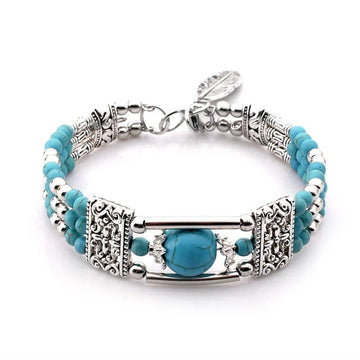 Women’s Multi-Strand Pearl Bracelet with Round Center Piece and Ornamental Details