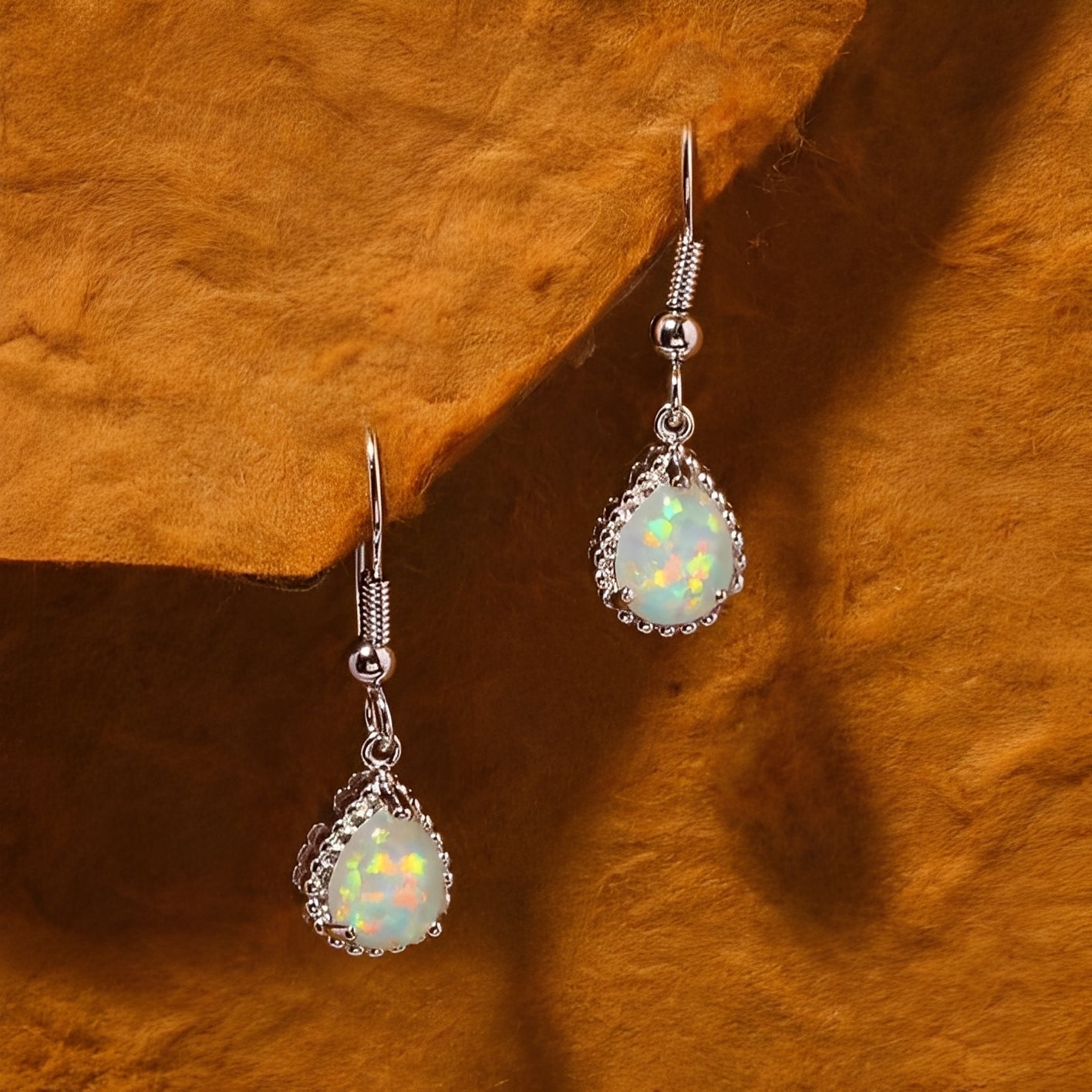 Emeline – Hanging Earrings made of Silver & White Fire Opal