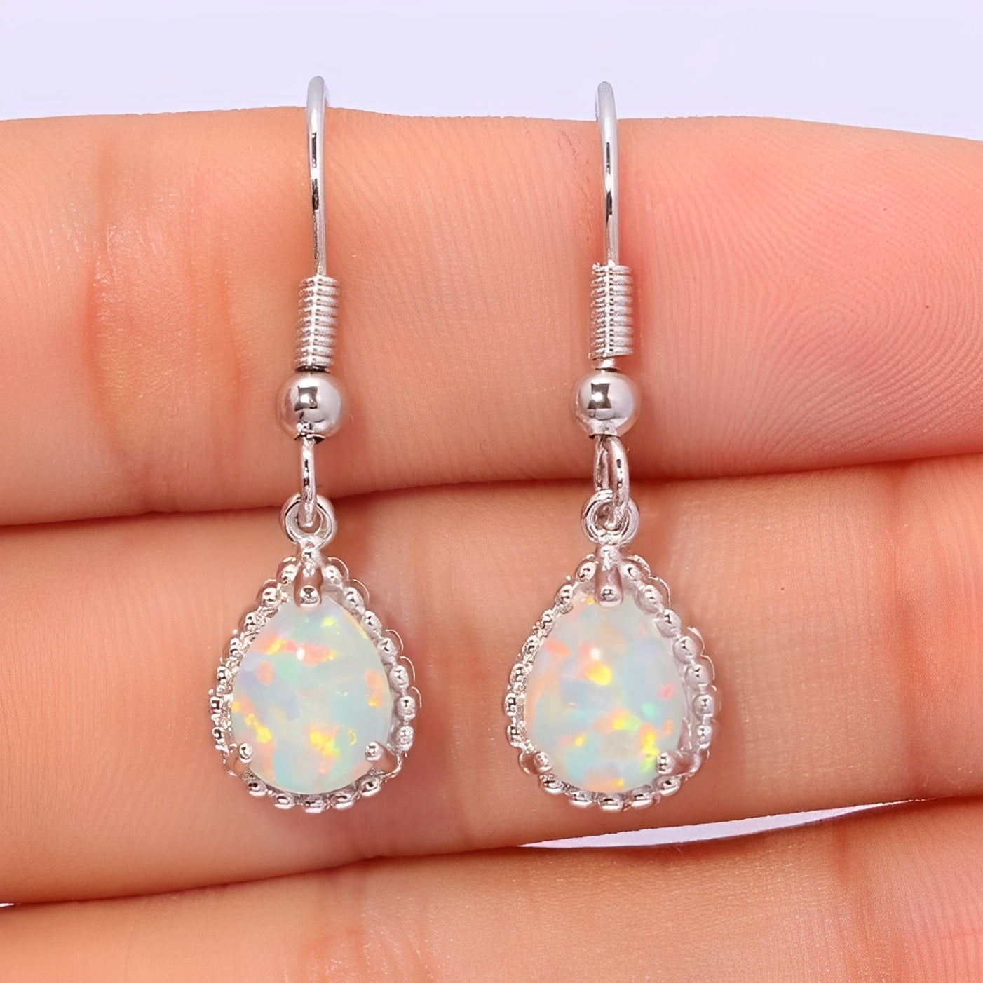 Emeline – Hanging Earrings made of Silver & White Fire Opal