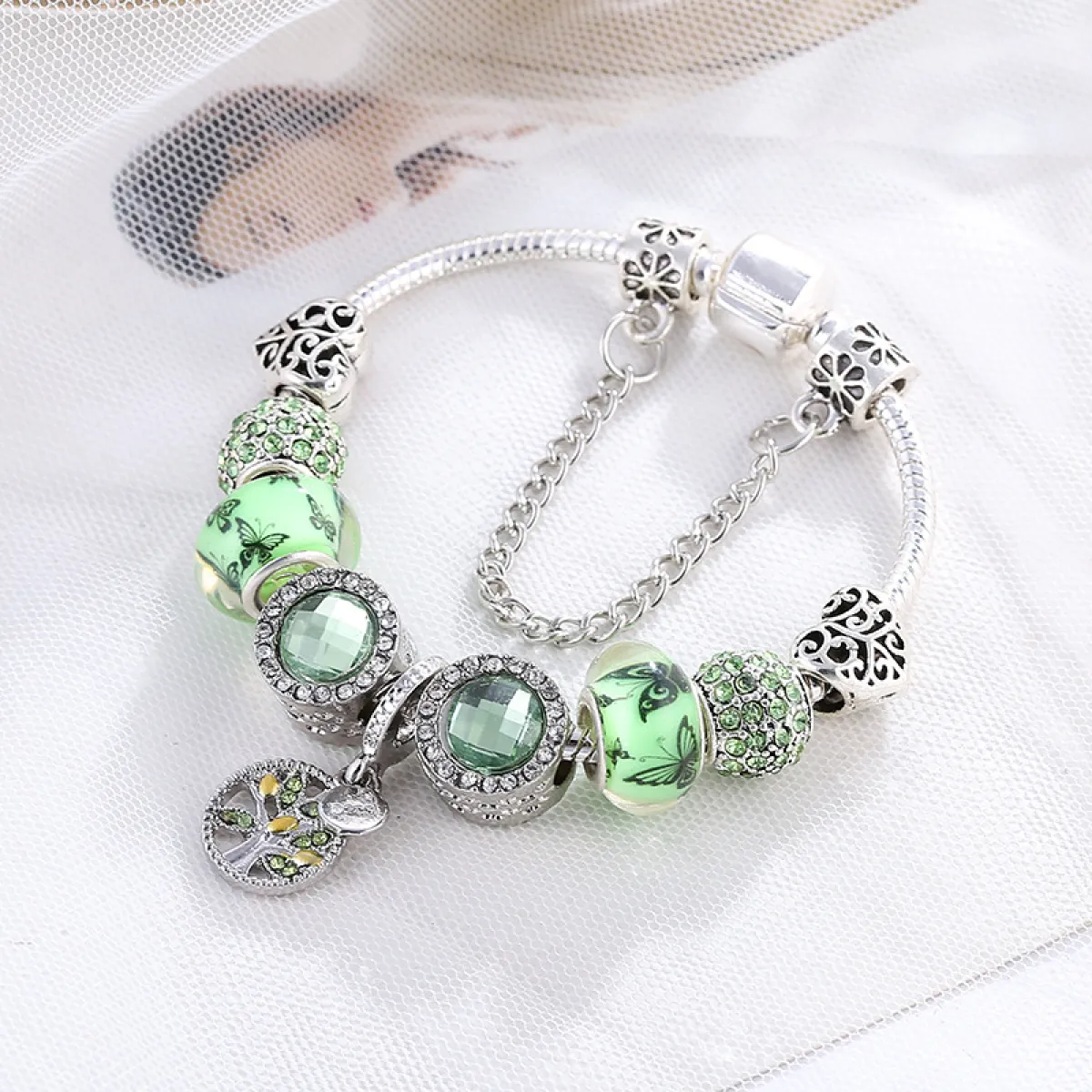 Women’s Charm Bracelet with Floral Motifs and Multiple Decorative Elements
