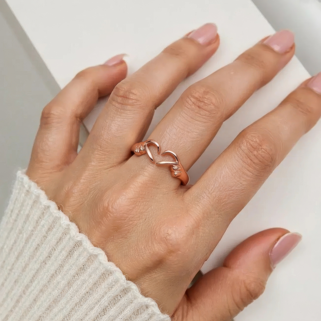 Women’s Adjustable Ring with Embracing Hands and Open Design
