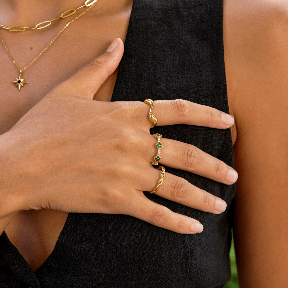 Women’s Ring with Floral Stone Clusters and Round Stone Setting