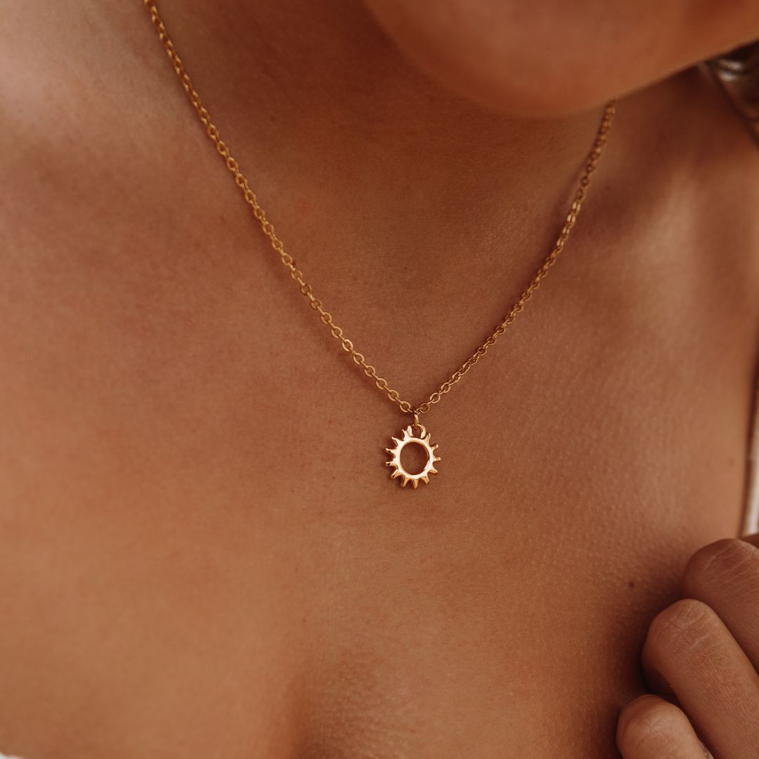 Women's Sun Pendant Necklace with Open Round Design and Ray Border