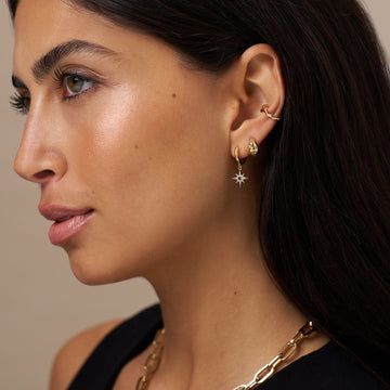Women’s Huggie Hoops with Starburst Engraving and Clear Stone Accents