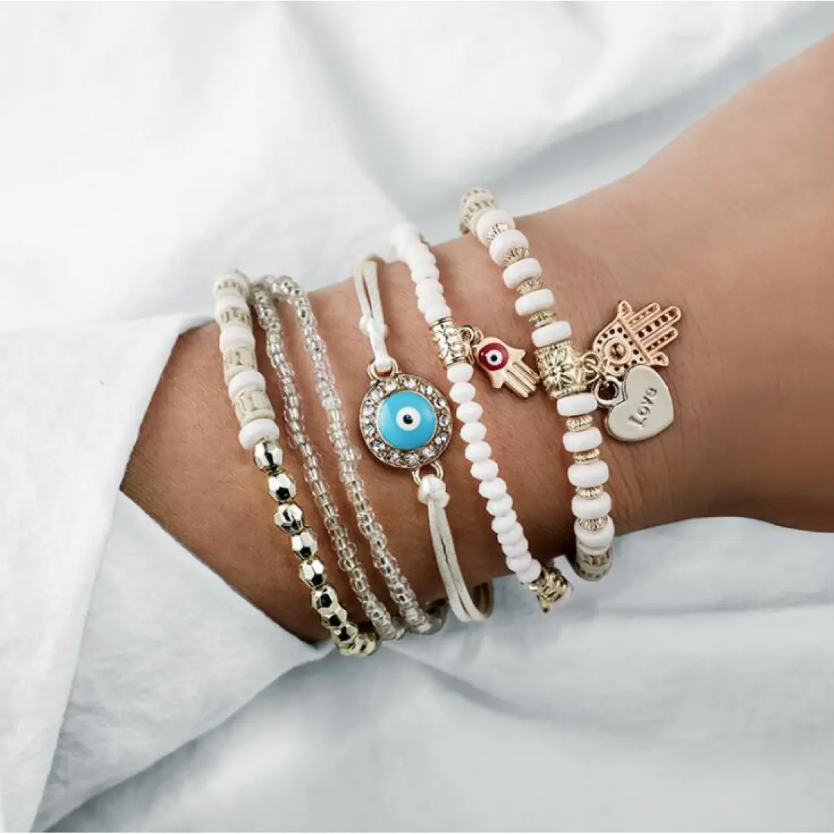 Women's Multi-Part Bracelet Set with Hamsa, Eye, and Charm Details
