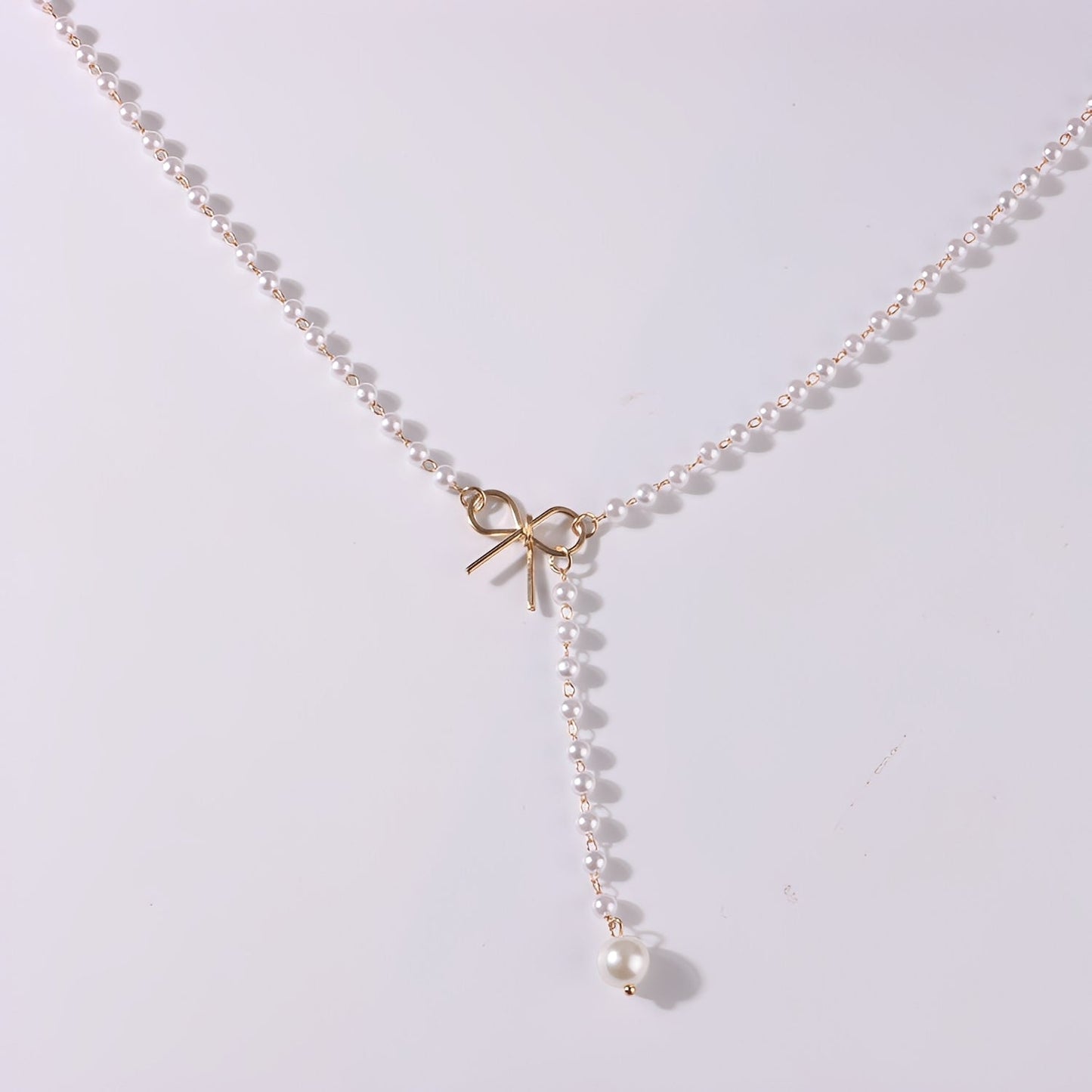 Antoneth – Necklace with Bow-Shaped Pendant and Pearl
