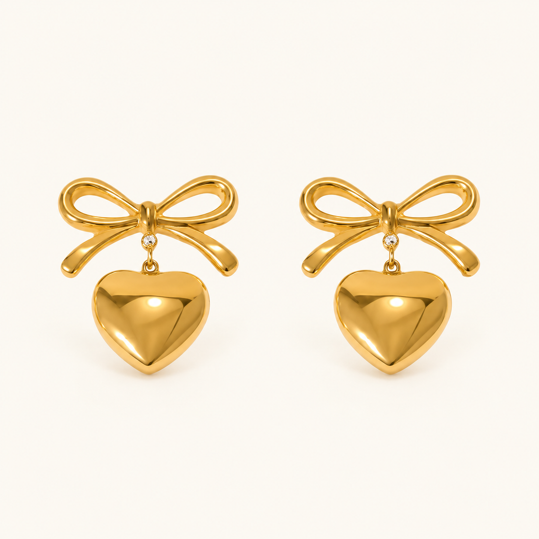 Women’s Ear Studs with Bow Motif and Hanging Heart Pendant