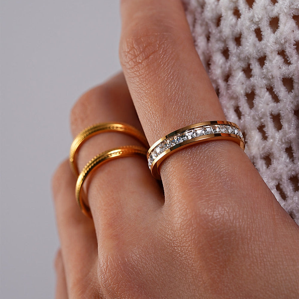 Women's Ring with Continuous Stone Setting and Smooth Wide Band