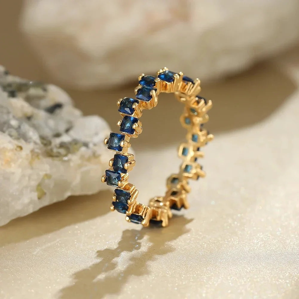 Women's Ring with Scattered Square Stone Accents and Offset Design