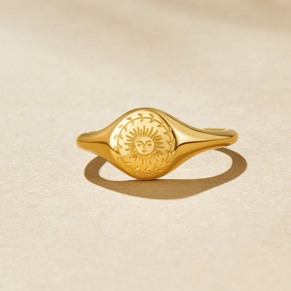 Women’s Signet Ring with Sun Motif and Floral Border Engraving