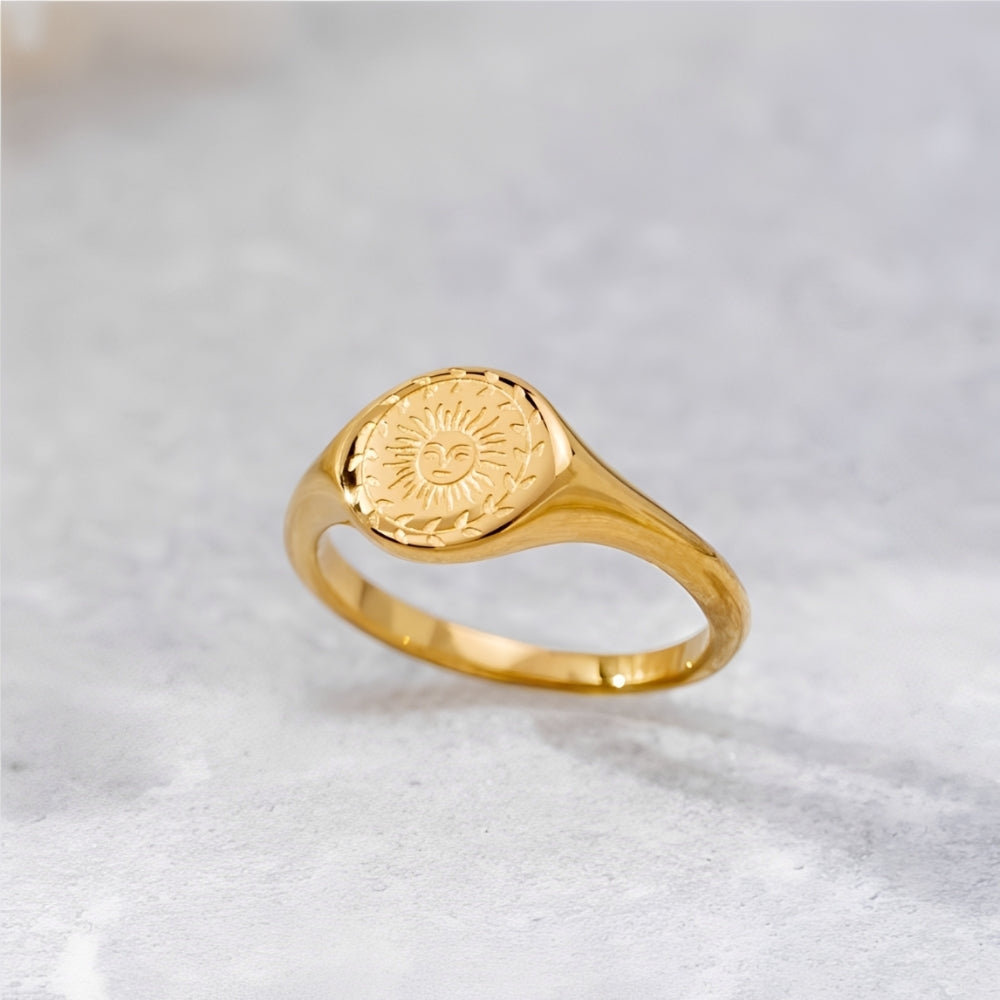 Women’s Signet Ring with Sun Motif and Floral Border Engraving