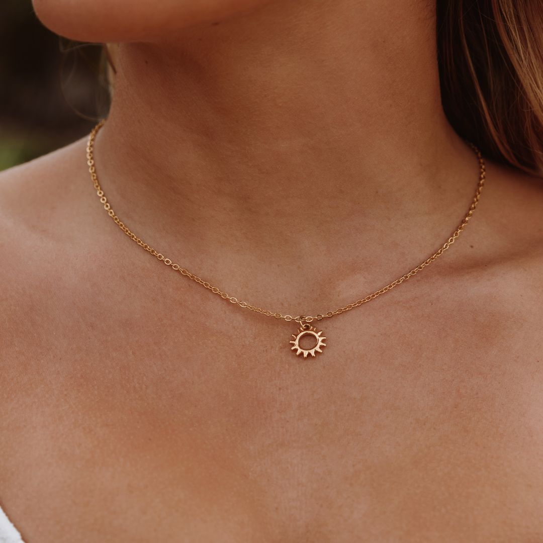 Women's Sun Pendant Necklace with Open Round Design and Ray Border