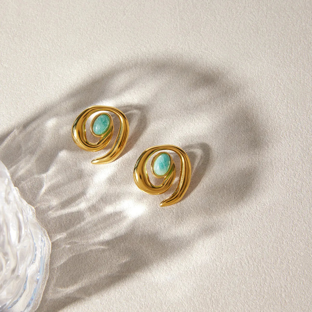 Women's Statement Ear Studs with Swirled Design and Oval Center Stone